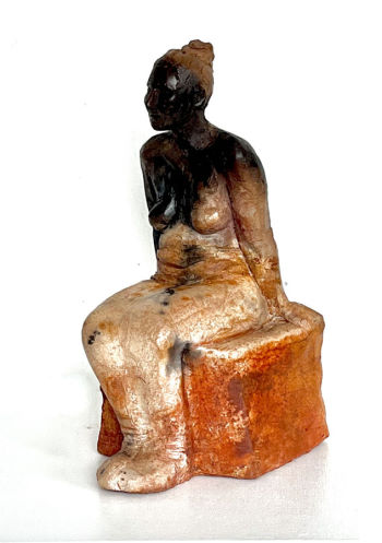 Sitzende Frau